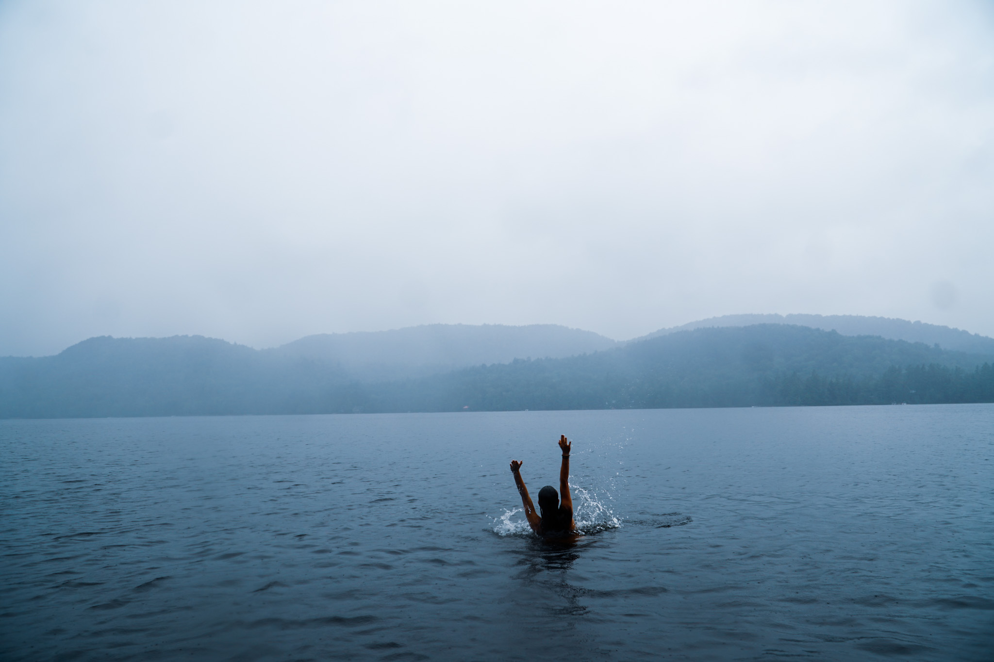 Swimming in a misty mountain lake